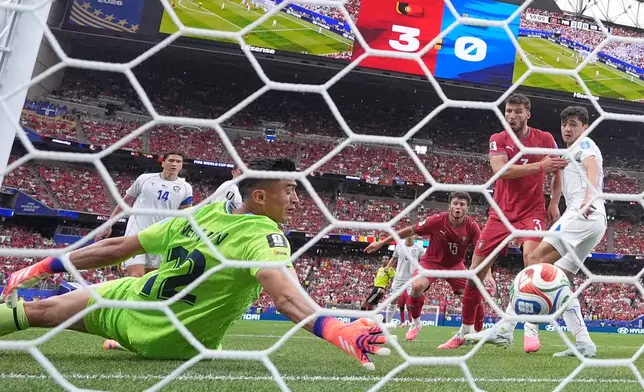Uzbekistan goalkeeper Abduvohid Nematov (12) scores an own goal during the World Cup Group K soccer match between Portugal and Uzbekistan in Houston, Tuesday, June 23, 2026. (AP Photo/Eric Gay)