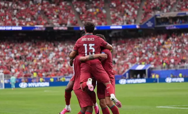 Portugal players celebrate celebrate their side's fourth goal during the World Cup Group K soccer match between Portugal and Uzbekistan in Houston, Tuesday, June 23, 2026. (AP Photo/Eric Gay)