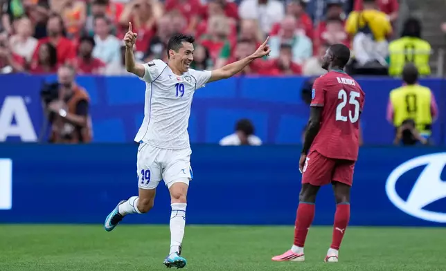 Uzbekistan's Azizjon Ganiev celebrates after scoring a goal later disallowed during the World Cup Group K soccer match between Portugal and Uzbekistan in Houston, Tuesday, June 23, 2026. (AP Photo/Ashley Landis)
