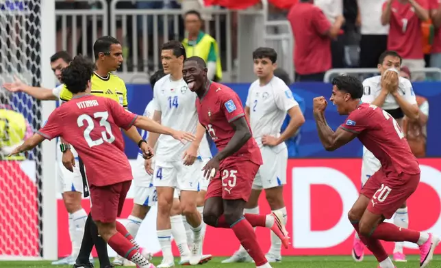 Portugal's Nuno Mendes (25) celebrates after scoring his side's second goal during the World Cup Group K soccer match between Portugal and Uzbekistan in Houston, Tuesday, June 23, 2026. (AP Photo/Eric Gay)