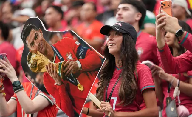 A fan of Portugal waits for the kickoff of the World Cup Group K soccer match between Portugal and Uzbekistan in Houston, Tuesday, June 23, 2026. (AP Photo/Eric Gay)