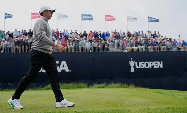 Rory McIlroy, of Northern Ireland, walks off the tee on the 12th hole during the first round of the U.S. Open golf tournament at Shinnecock Hills Golf Club in Southampton, N.Y., Thursday, June 18, 2026.(AP Photo/George Walker IV)