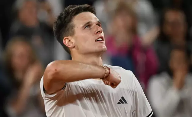 Czech Republic's Jakub Mensik reacts after winning the quarterfinal tennis match against Brazil's Joao Fonseca at the French Open in Paris, Tuesday, June 2, 2026. (AP Photo/Emma Da Silva)