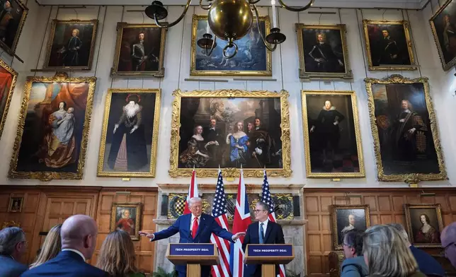 FILE - President Donald Trump gestures next to Britain's Prime Minister Keir Starmer during a joint press conference at Chequers near Aylesbury, England, Thursday, Sept. 18, 2025. (AP Photo/Evan Vucci, File)