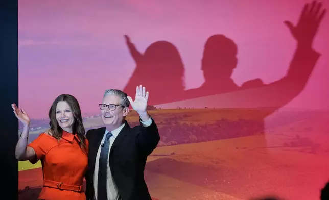 FILE - Britain's Prime Minister Keir Starmer and his wife Victoria wave to the delegates and audience after he gave his keynote speech at the annual Labour Party conference in Liverpool, England, Tuesday, Sept. 30, 2025. (AP Photo/Jon Super, File)