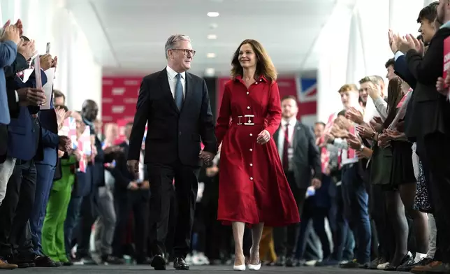 FILE - Britain's Prime Minister Keir Starmer and his wife, Victoria, arrive at the Labour Party Conference in Liverpool, England, Sept. 24, 2024. (AP Photo/Jon Super, File)