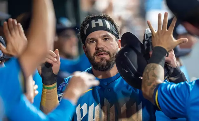 Philadelphia Phillies' Kyle Schwarber celebrates his run on the sacrifice fly with teammates during the seventh inning of a baseball game against the Chicago White Sox, Friday, June 5, 2026, in Philadelphia. (AP Photo/Chris Szagola)