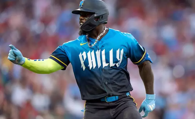 Philadelphia Phillies' Adolis Garcia reacts after his home run during the fourth inning of a baseball game against the Chicago White Sox, Friday, June 5, 2026, in Philadelphia. (AP Photo/Chris Szagola)