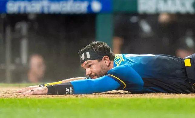 Philadelphia Phillies' Kyle Schwarber looks on as he scores on the sacrifice fly by Edmundo Sosa during the seventh inning of a baseball game against the Chicago White Sox, Friday, June 5, 2026, in Philadelphia. (AP Photo/Chris Szagola)