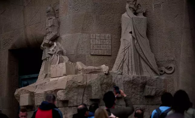 A detail of the Passion Façade shows the basilica's famous magic square at the Sagrada Família in Barcelona, Spain, May 15, 2026. Unlike a sudoku, every row, column and diagonal adds up to 33, symbolizing the age of Christ at his death.(AP Photo/Emilio Morenatti)