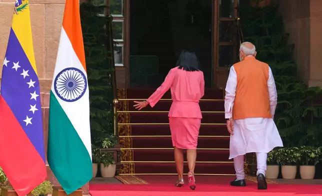 Indian Prime Minister Narendra Modi, right, walks with Venezuela's acting President Delcy Rodriguez for a delegation level meeting in New Delhi, India, Thursday, June 4, 2026. (AP Photo/Manish Swarup)