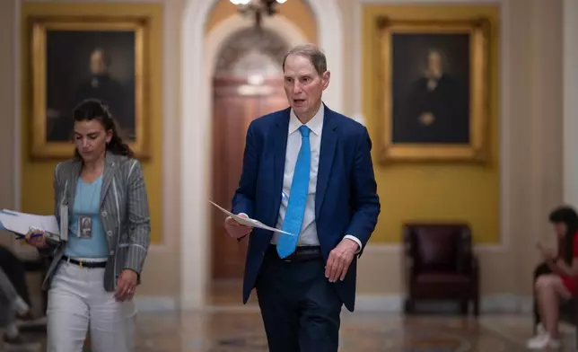 Sen. Ron Wyden, D-Ore., walks to the chamber during votes on the immigration enforcement funding package, at the Capitol in Washington, Thursday, June 4, 2026. (AP Photo/J. Scott Applewhite)
