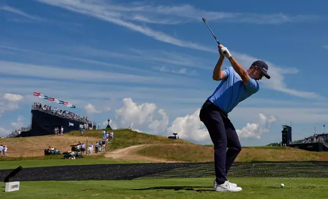 Justin Rose, of England, hits his tee shot on the 11th hole during a practice round for the U.S. Open golf tournament at Shinnecock Hills Golf Club in Southampton, N.Y., Wednesday, June 17, 2026.(AP Photo/David J. Phillip)