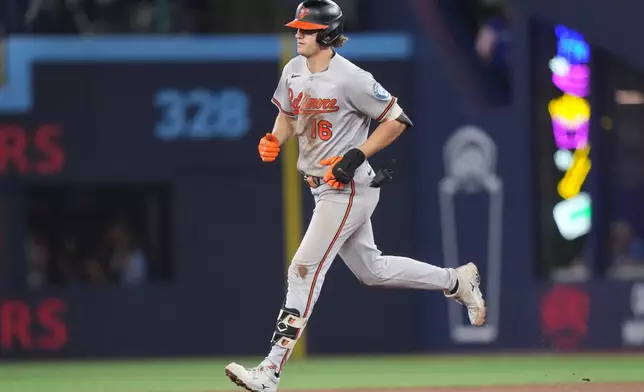 Baltimore Orioles' Coby Mayo rounds the bases after hitting a home run against the Toronto Blue Jays during sixth-inning baseball game action in Toronto, Friday, June 5, 2026. (Nathan Denette/The Canadian Press via AP)