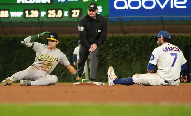 Chicago Cubs shortstop Dansby Swanson (7) tags out Athletics' Tyler Soderstrom (21) at second base during the eighth inning in a baseball game Wednesday, June 3, 2026, in Chicago. (AP Photo/David Banks)