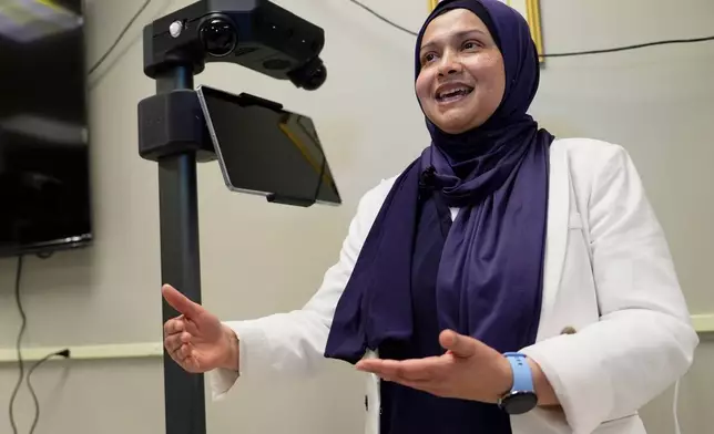 Momotaz Begum, a professor of computer sciences, speaks about the robotics program at the University of New Hampshire, Tuesday, April 21, 2026, in Durham, N.H. (AP Photo/Robert F. Bukaty)