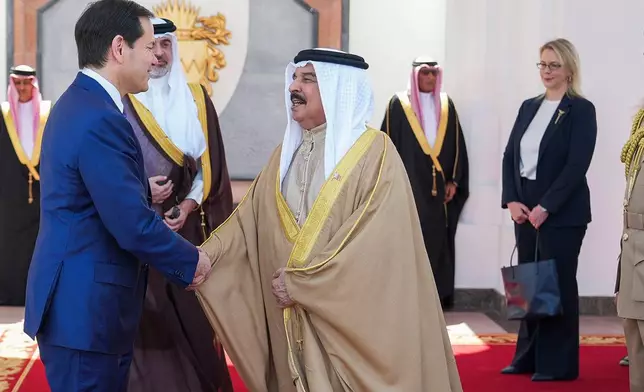 U.S. Secretary of State Marco Rubio, left, and Bahrain's King Hamad bin Isa Al Khalifa salute eachother after their meeting as U.S. Ambassador to Bahrain Stephanie Hallett looks on at right, at Al-Sakhir Palace near Zallaq, Bahrain Thursday, June 25, 2026. U.S. Ambassador to Bahrain Stephanie Hallett. (Eric Lee/Pool Photo via AP)