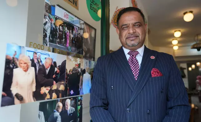 Oli Khan, the senior vice president of the Bangladesh Caterers Association UK, poses for a portrait at a Bangladeshi restaurant in London, Thursday, June 18, 2026. (AP Photo/Kin Cheung)