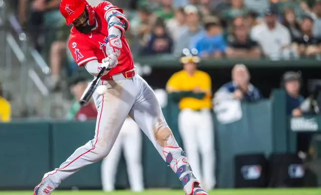 Los Angeles Angels' Jo Adell hits a double during the eighth inning of a baseball game against the Athletics in West Sacramento, Calif., Saturday, June 20, 2026. (AP Photo/Nic Coury)