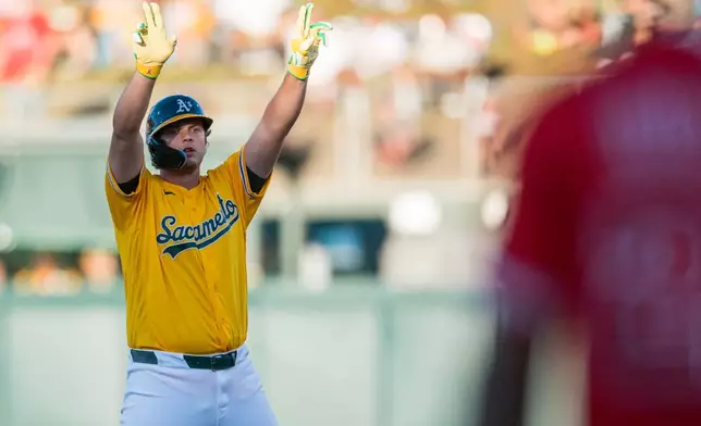 Athletics' Nick Kurtz celebrates after hitting a double during the first inning of a baseball game against the Los Angeles Angels in West Sacramento, Calif., Saturday, June 20, 2026. (AP Photo/Nic Coury)