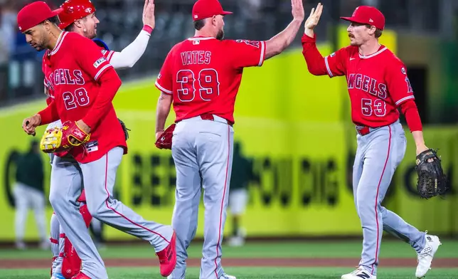 The Los Angeles Angels celebrate after winning a baseball game against the Athletics in West Sacramento, Calif., Saturday, June 20, 2026. (AP Photo/Nic Coury)