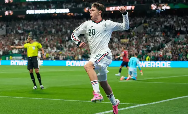 Mexico's Mateo Chavez celebrates scoring the opening goal during a World Cup Group A soccer match between Mexico and Czechia in Mexico City, Wednesday, June 24, 2026. (AP Photo/Silvia Izquierdo)
