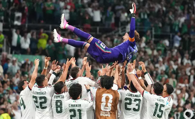 Mexico goalkeeper Guillermo Ochoa, top, celebrates with teammates following the World Cup Group A soccer match between Czechia and Mexico in Mexico City, Wednesday, June 24, 2026. (AP Photo/Fernando Llano)