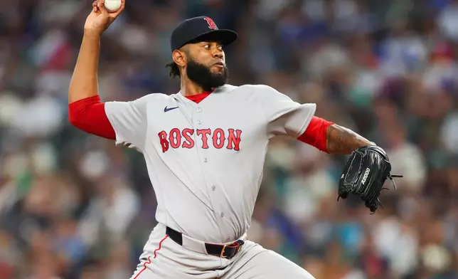 Boston Red Sox pitcher Tayron Guerrero delivers during the seventh inning of a baseball game against the Seattle Mariners, Saturday, June 20, 2026, in Seattle. (AP Photo/Kevin Ng)