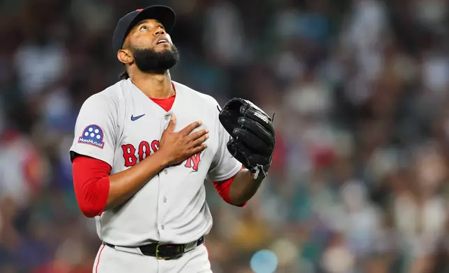 Boston Red Sox pitcher Tayron Guerrero reacts in the seventh inning of a baseball game against the Seattle Mariners, Saturday, June 20, 2026, in Seattle. (AP Photo/Kevin Ng)
