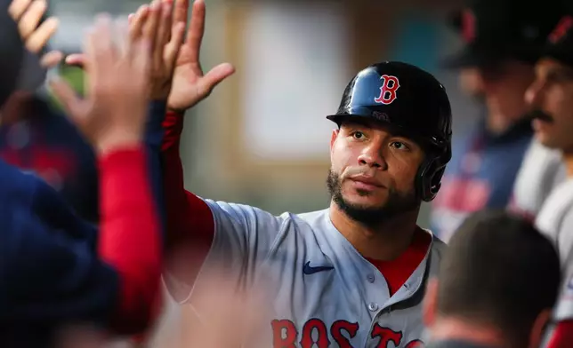 Boston Red Sox's Willson Contreras celebrates after scoring on a single hit by Caleb Durbin in the sixth inning of a baseball game against the Seattle Mariners, Saturday, June 20, 2026, in Seattle. (AP Photo/Kevin Ng)