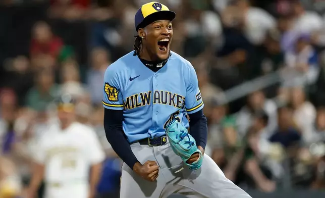 Milwaukee Brewers relief pitcher Abner Uribe (45) reacts after striking out the final batter to end the inning during the eleventh inning of a baseball game against the Athletics, Monday, June 8, 2026, in Las Vegas. (AP Photo/Caroline Brehman)