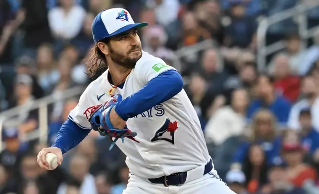 Toronto Blue Jays pitcher Dylan Cease throws to a Houston Astros batter during the first inning of a baseball game in Toronto, Monday, June 22, 2026. (Jon Blacker/The Canadian Press via AP)