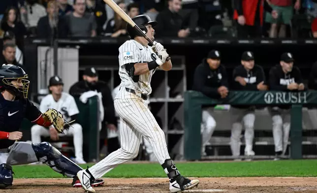 Chicago White Sox's Sam Antonacci watches his two-run single during the ninth inning of a baseball game against the Cleveland Guardians, Monday, June 22, 2026, in Chicago. (AP Photo/Matt Marton)