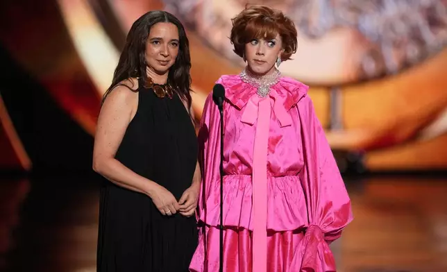 Maya Rudolph, left, and Cole Escola present the award for best performance by a leading actor in a play during the 79th Tony Awards on Sunday, June 7, 2026, at Radio City Music Hall in New York. (Photo by Charles Sykes/Invision/AP)