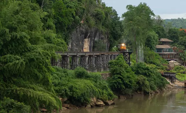 A train approaches Thamkra Sae Station, one of the still active sections of the infamous World War II "Death Railway," in Sai Yok, Thailand, Thursday, May 28, 2026. (AP Photo/Anton L. Delgado)