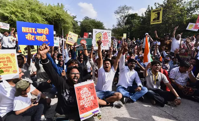 Protesters shout slogans during a nationwide protest campaign launched by Abhijeet Dipke, founder of the Cockroach Janta Party, in Pune, India, Thursday, June 11, 2026. (AP Photo/Mahendra Kolhe)