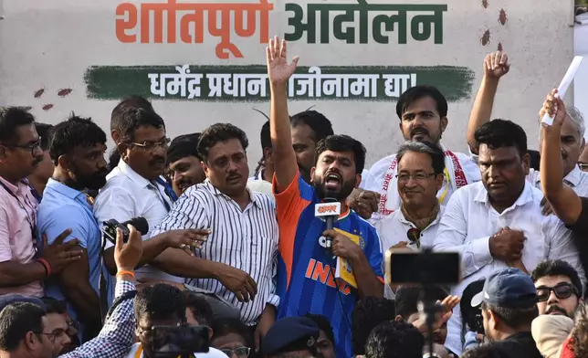 Abhijeet Dipke, center, founder of the Cockroach Janta Party, addresses his supporters after launching a nationwide protest campaign in Pune, India, Thursday, June 11, 2026. (AP Photo/Mahendra Kolhe)
