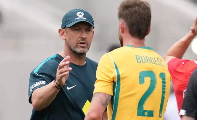 Australia manager Tony Popovic greets players after an international friendly soccer game against Switzerland Saturday, June 6, 2026, in San Diego. (AP Photo/Gregory Bull)