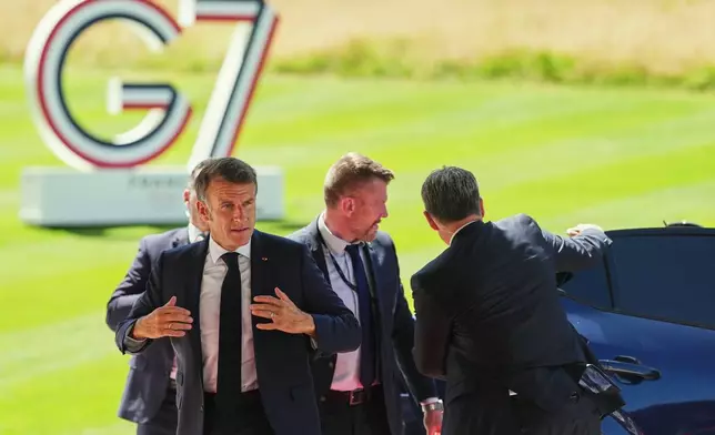 French President Emmanuel Macron arrives for the G7 summit in Evian-les-Bains, France, Monday, June 15, 2026. (AP Photo/Thibault Camus)