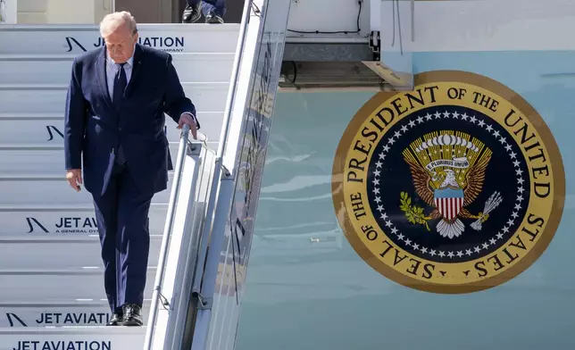 President Donald Trump disembarks from Air Force One at Geneva Airport, Switzerland, prior the G7 summit, Monday, June 15, 2026. (Martial Trezzini/Pool Photo via AP)