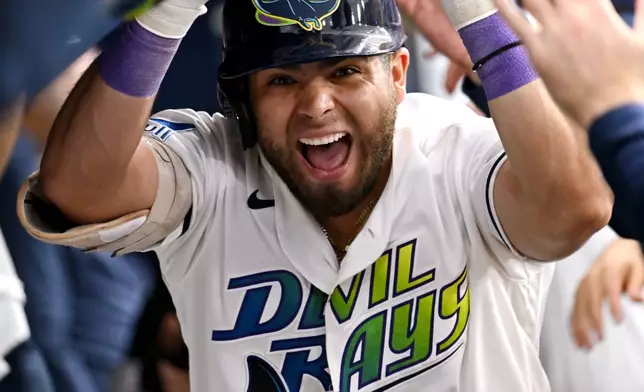 Tampa Bay Rays' Jonathan Aranda celebrates after his three-run home run during the third inning of a baseball game against the Washington Nationals, Friday, June 19, 2026, in St. Petersburg, Fla. (AP Photo/Jason Behnken)