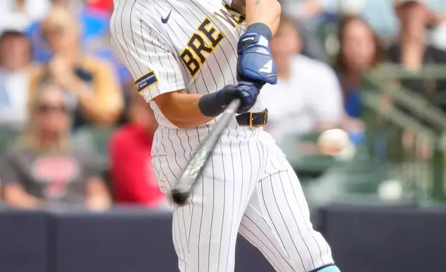 Milwaukee Brewers' Blake Perkins hits a three-run home run during the fourth inning of a baseball game against the Philadelphia Phillies, Sunday, June 14, 2026, in Milwaukee. (AP Photo/Kayla Wolf)