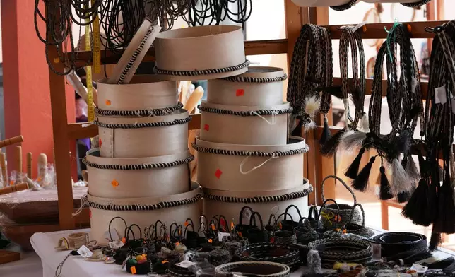 Woven horsehair sieves, a mesh known as a “cedazo,” and crafted like a drum, are on display in Guangopolo, Ecuador, Wednesday, June 3, 2026. (AP Photo/Dolores Ochoa)