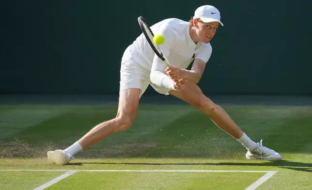 FILE - Italy's Jannik Sinner returns to Carlos Alcaraz of Spain in the men's singles final at the Wimbledon Tennis Championships in London, Sunday, July 13, 2025. (AP Photo/Kin Cheung, File)