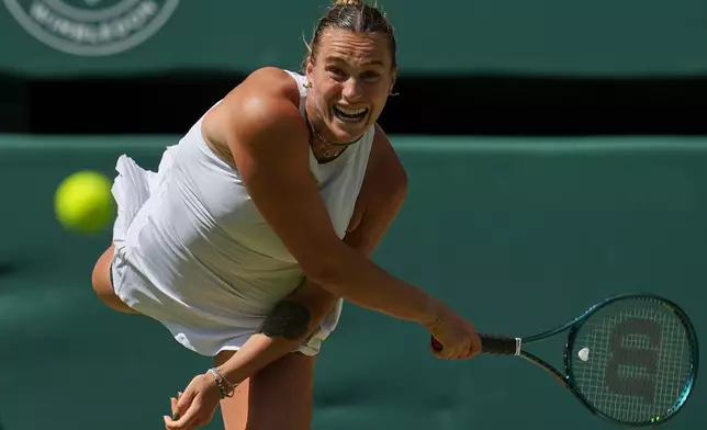 FILE - Aryna Sabalenka of Belarus serves to Amanda Anisimova of the U.S. during a women's singles semifinal match at the Wimbledon Tennis Championships in London, Thursday, July 10, 2025. (AP Photo/Kin Cheung, File)
