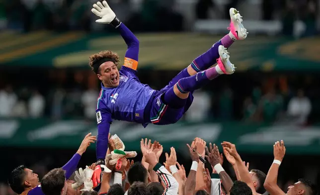 Mexico goalkeeper Guillermo Ochoa (13) is celebrated by his team after the World Cup Group A soccer match between Czechia and Mexico in Mexico City, Wednesday, June 24, 2026. (AP Photo/Natacha Pisarenko )