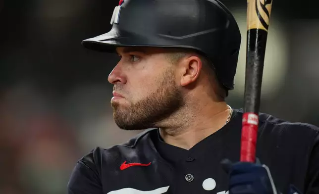 Minnesota Twins' Victor Caratini waits on-deck during the second inning of a baseball game against the Houston Astros in Houston, Monday, June 29, 2026. (AP Photo/Jon Shapley)
