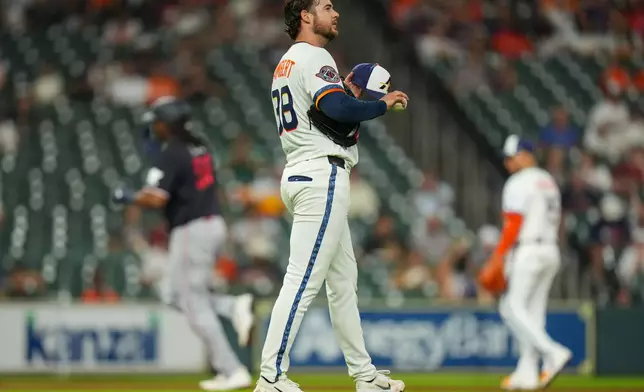 Houston Astros starting pitcher Peter Lambert, foreground, waits on the mound as Minnesota Twins designated hitter Josh Bell, back left, rounds the bases after hitting a home run during the sixth inning of a baseball game in Houston, Monday, June 29, 2026. (AP Photo/Jon Shapley)