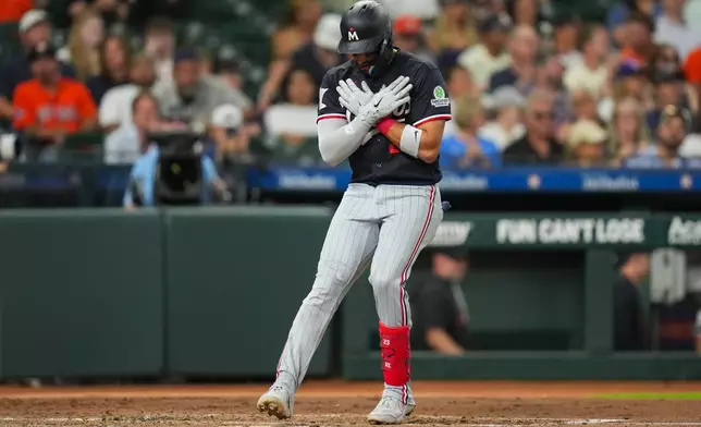 Minnesota Twins' Royce Lewis celebrates as he tags home after hitiing a solo home run during the fourth inning of a baseball game against the Houston Astros in Houston, Monday, June 29, 2026. (AP Photo/Jon Shapley)