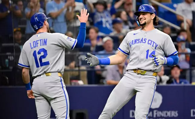 Kansas City Royals' Nick Loftin (12) and Jac Caglianone (14) celebrate Caglianone's two-run home run during the fifth inning of a baseball game against the Tampa Bay Rays Tuesday, June 23, 2026, in St. Petersburg, Fla. (AP Photo/Jason Behnken) CORRECTION: Corrects player at left to Nick Loftin, instead of Jac Caglianone.